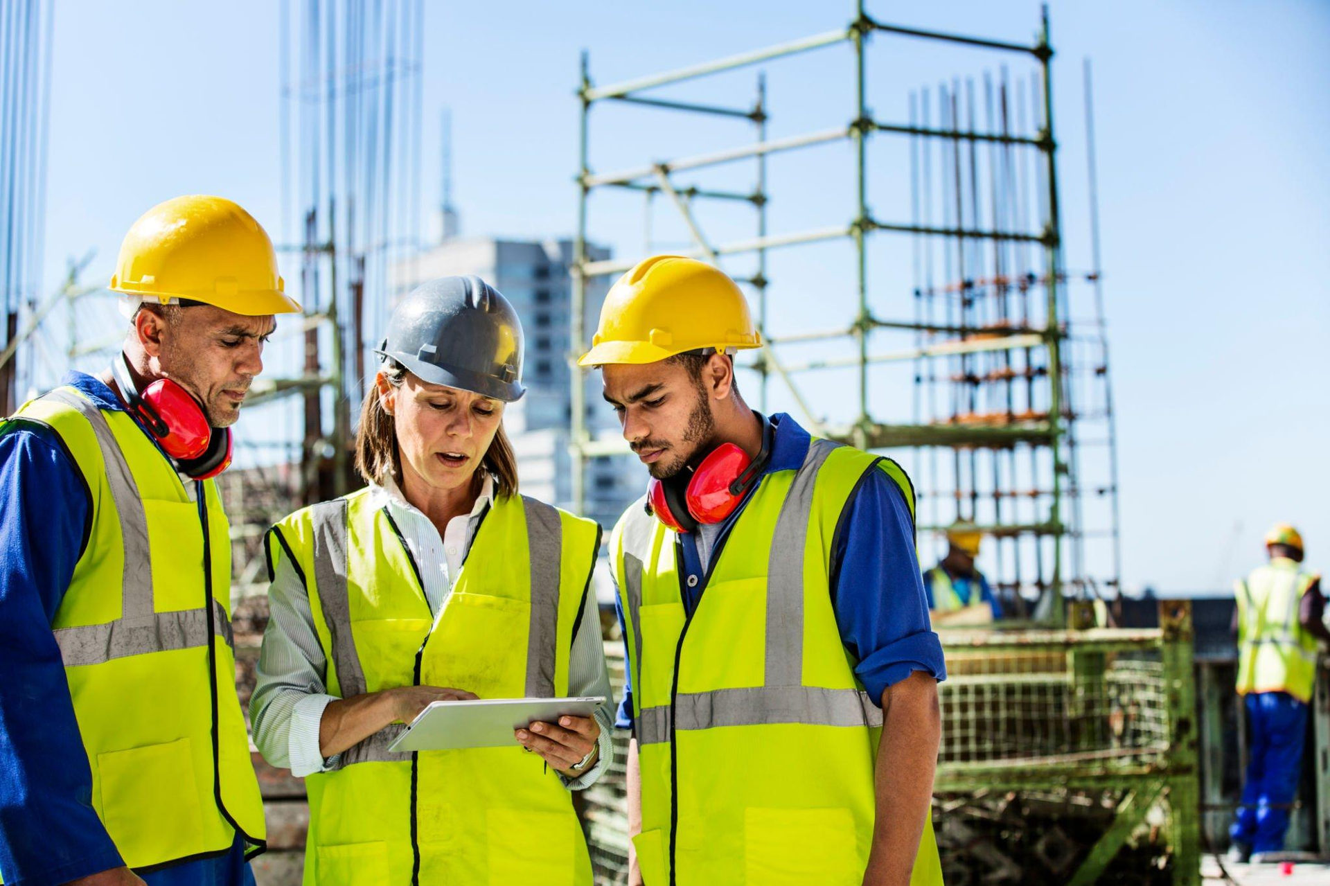 Skilled construction workers reviewing plans
